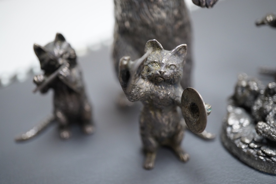 An Elizabeth II silver four piece miniature cat band by S.J. Rose & Son, Birmingham, 1976, tallest 58mm, together with a modern 925 miniature model of a standing grizzly bear and a modern silver model of a kitten(filled)